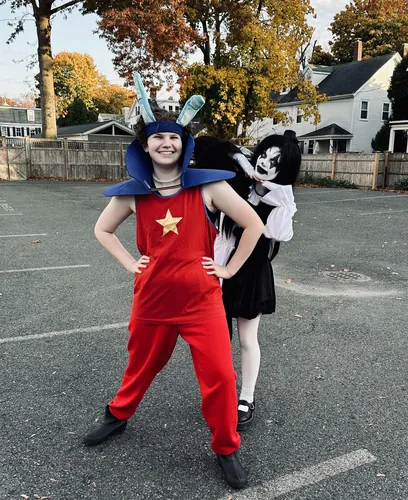 Two members pose in their Halloween costumes