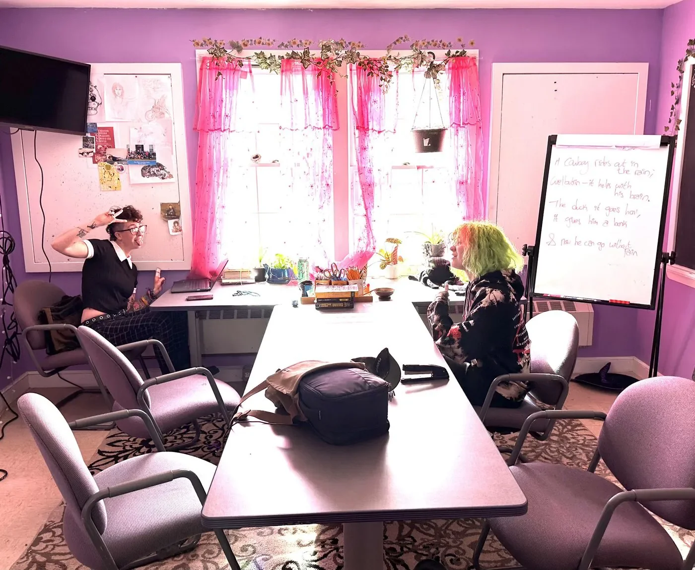 A mentor and member working together in a small class