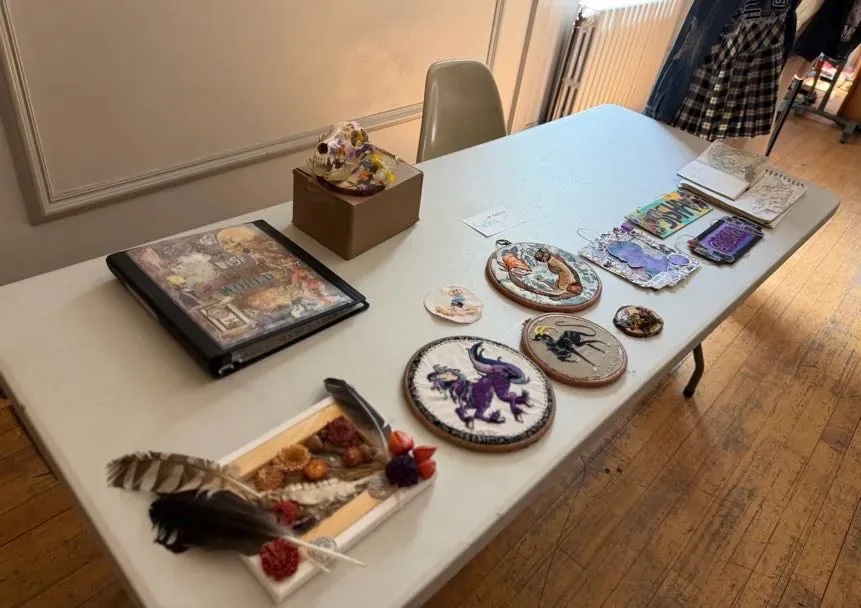 Sasha's table, filled with art.